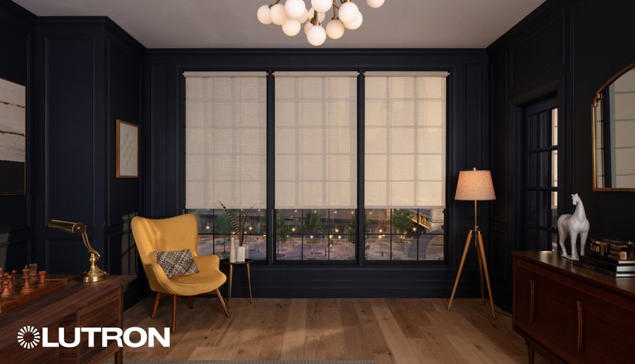 Elegant home office with automated roller shades and modern architectural lighting.